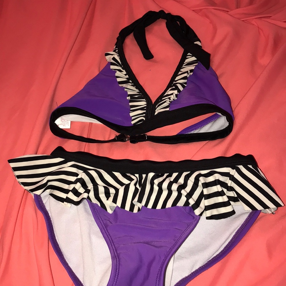 purple swimsuit runs a little big.